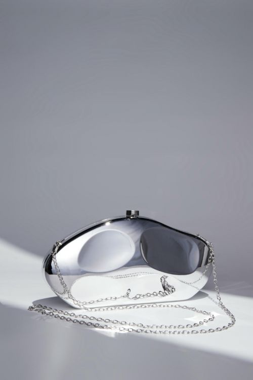 Silver shell-shaped clutch